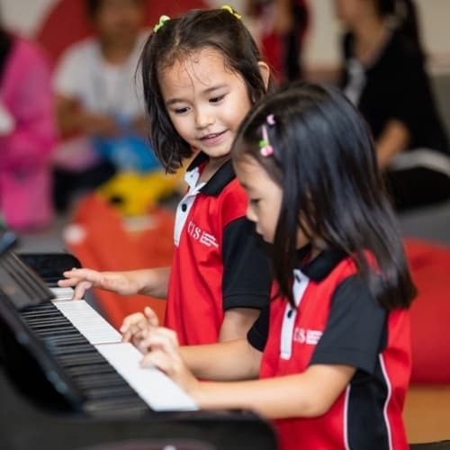 Students playing the piano