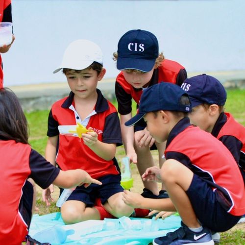 Kindergarten students engaged in outdoor learning