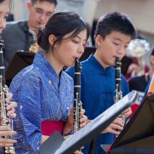 Students engaged in music lesson