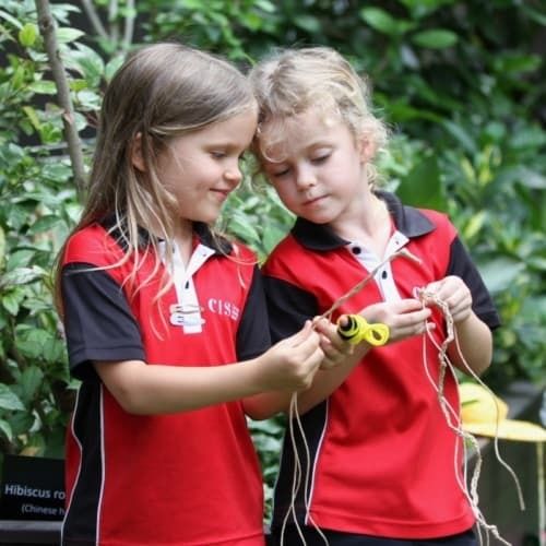 Kindergarten students engaged in outdoor learning